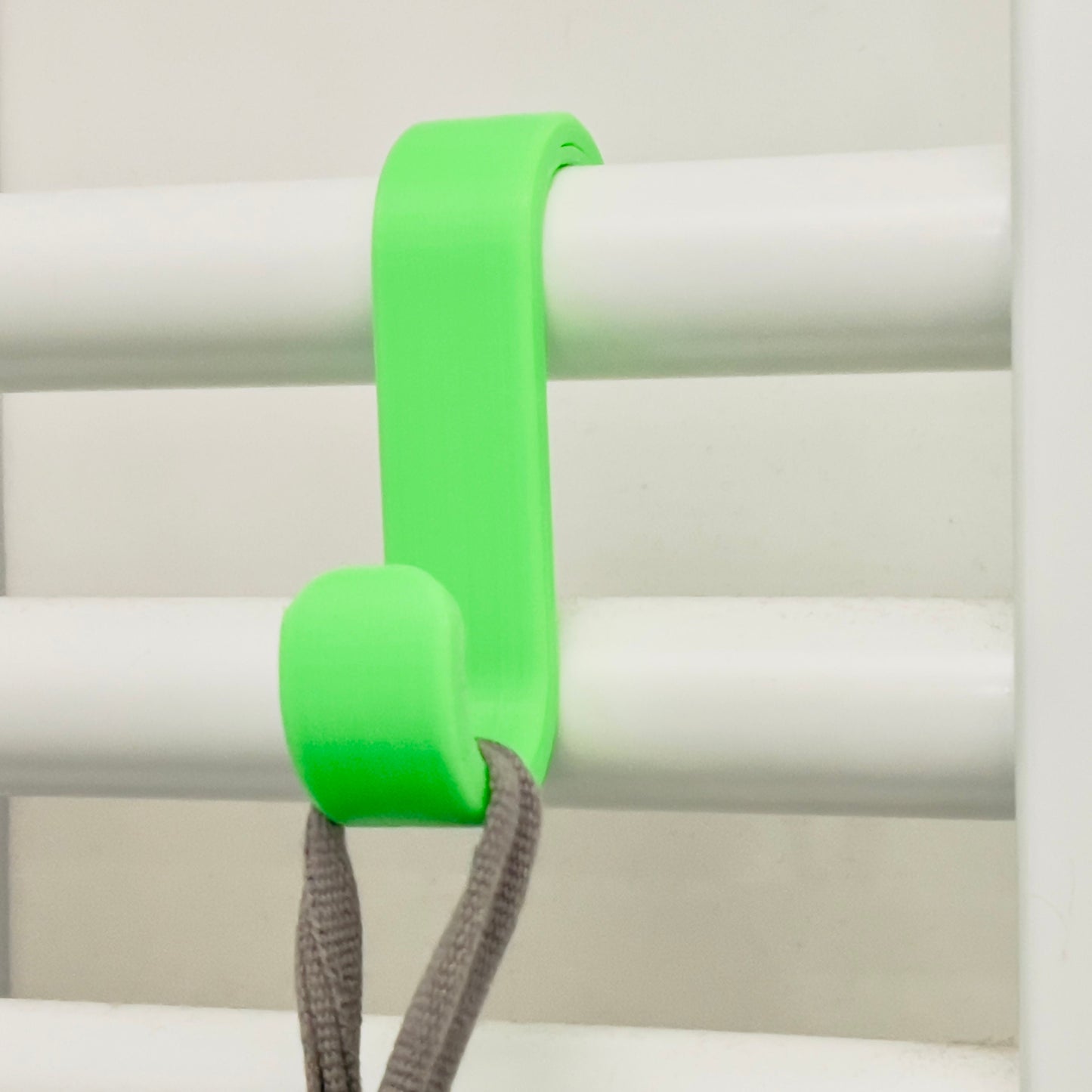 Towel hanger for bathroom radiator