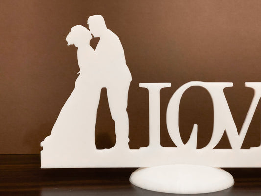 Wedding stand with kissing couple Love